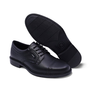 Zapato escolar de piel para niño color negro con diseño perforado 433804